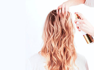 blonde woman with hair product