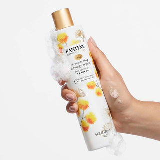 Strengthening Damage Repair Shampoo with Castor Oil in hand