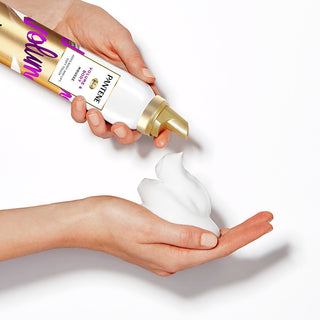 Volume & Body Mousse product in model's hand.